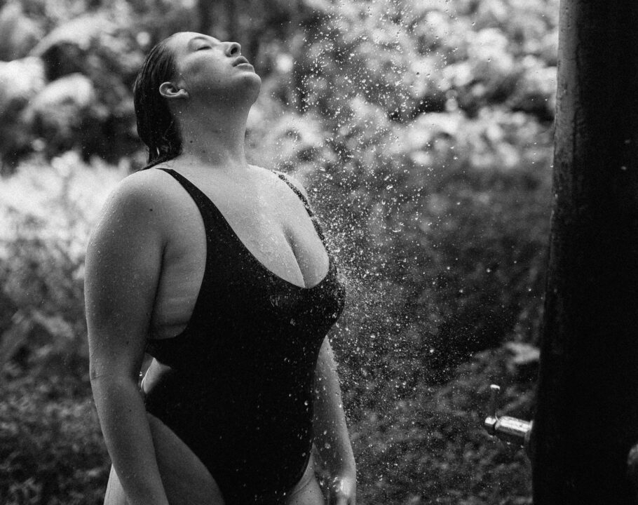 woman with curvy body in a bathing suit in an outdoor shadow