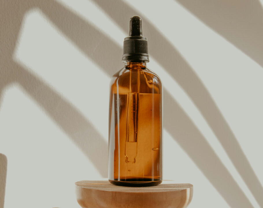 dropper bottle against a shadow backdrop