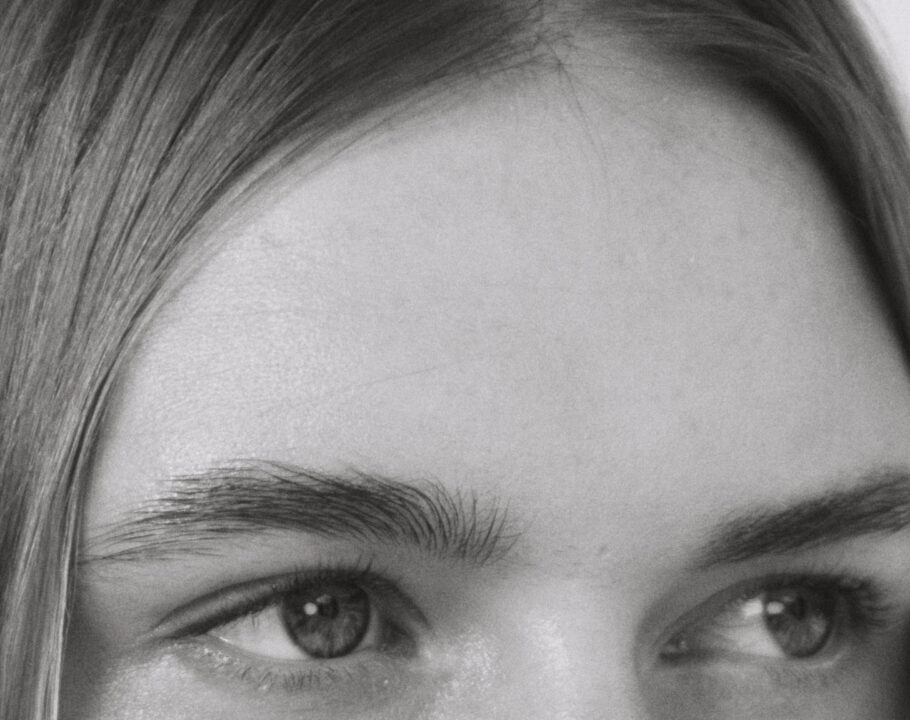 black and white photo of woman's forehead