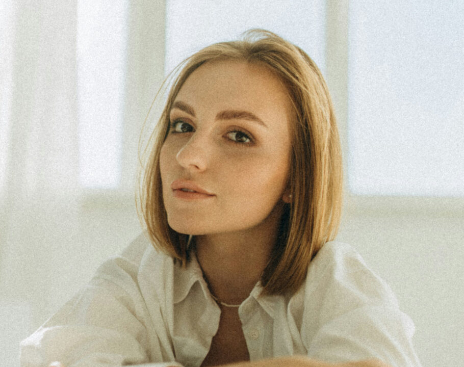 Woman with short hair in a white room