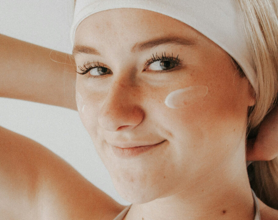 woman with face cream on her cheeks