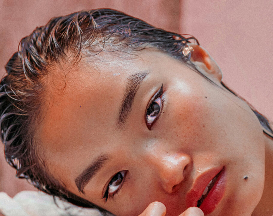 woman with slicked back wet hair