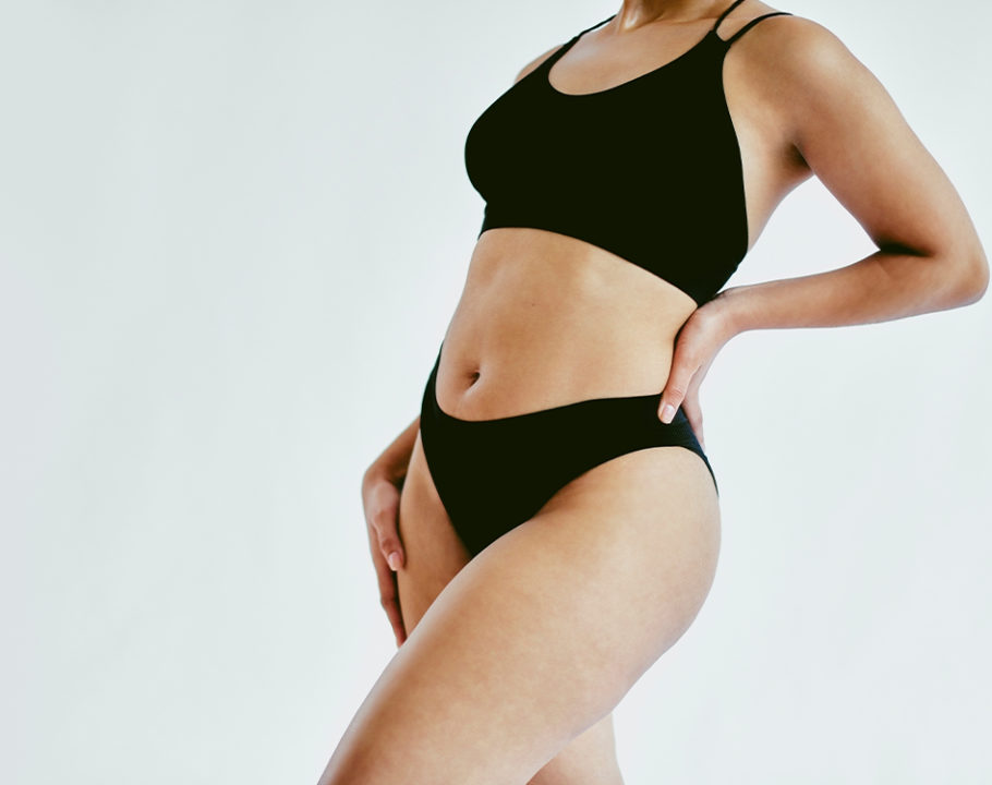 mid-view woman's body with black bralette and underwear