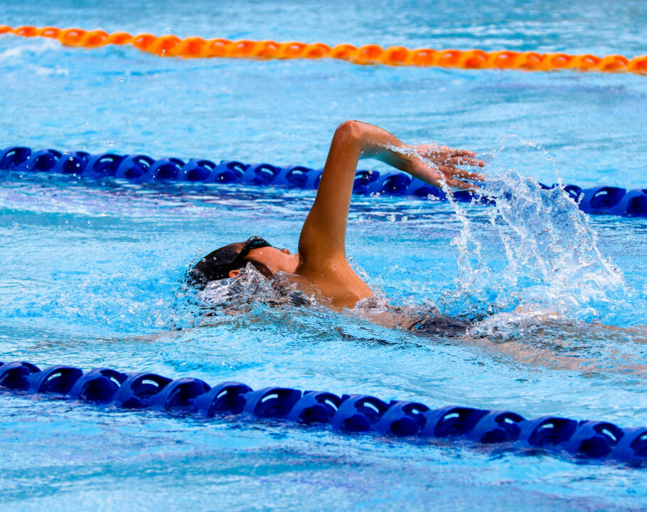 Swimmer swimming in Olympic size pool