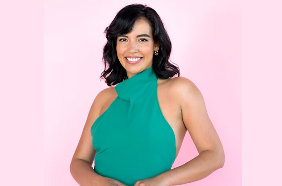 Photo of Danielle Olivera in front of a pink background copy