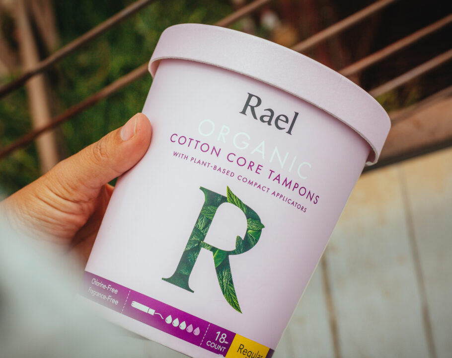 photo of a person holding a container of Rael organic tampons